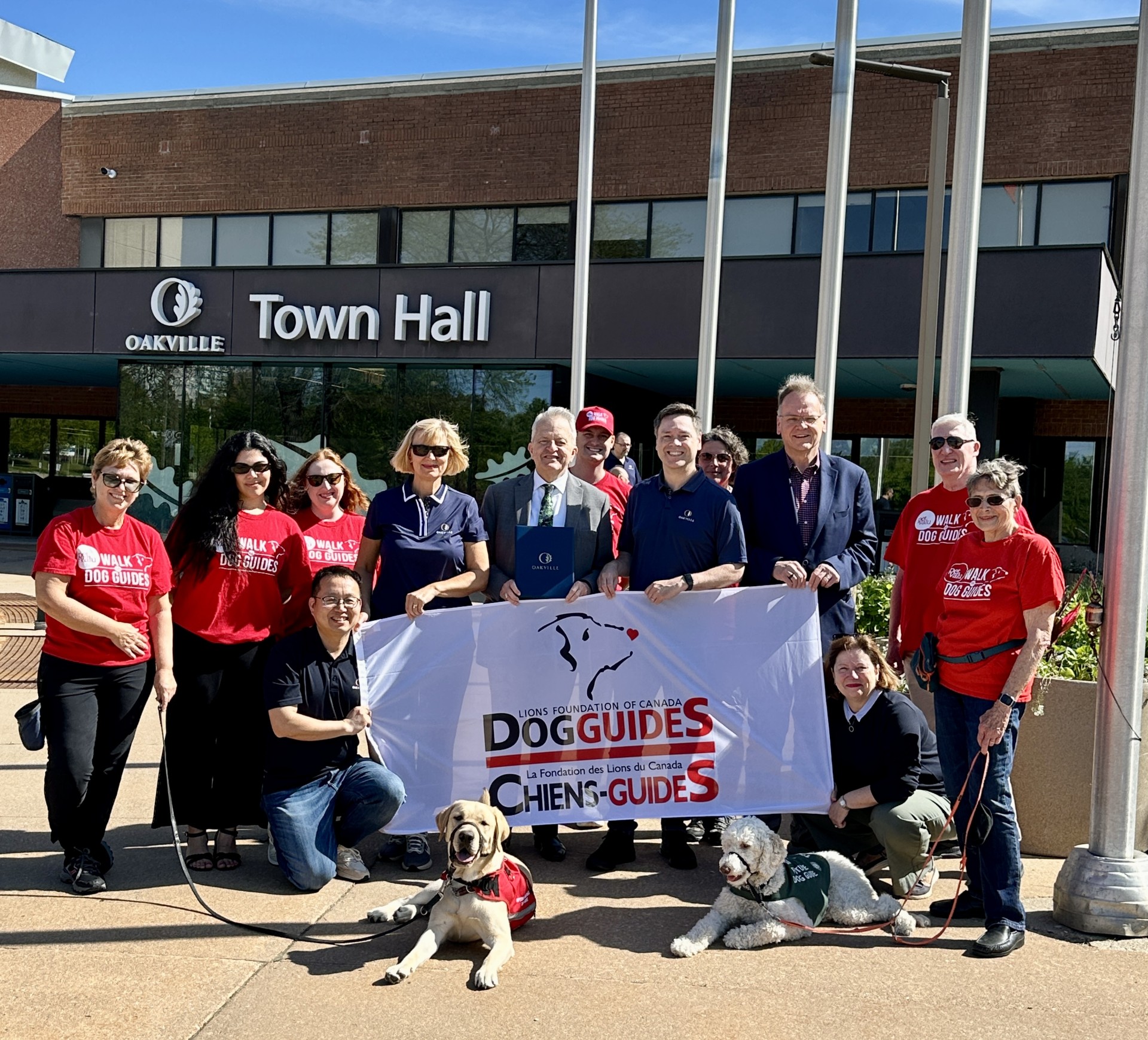 Raising the flag for the Lions Foundation Dog Guides walk at Town Hall