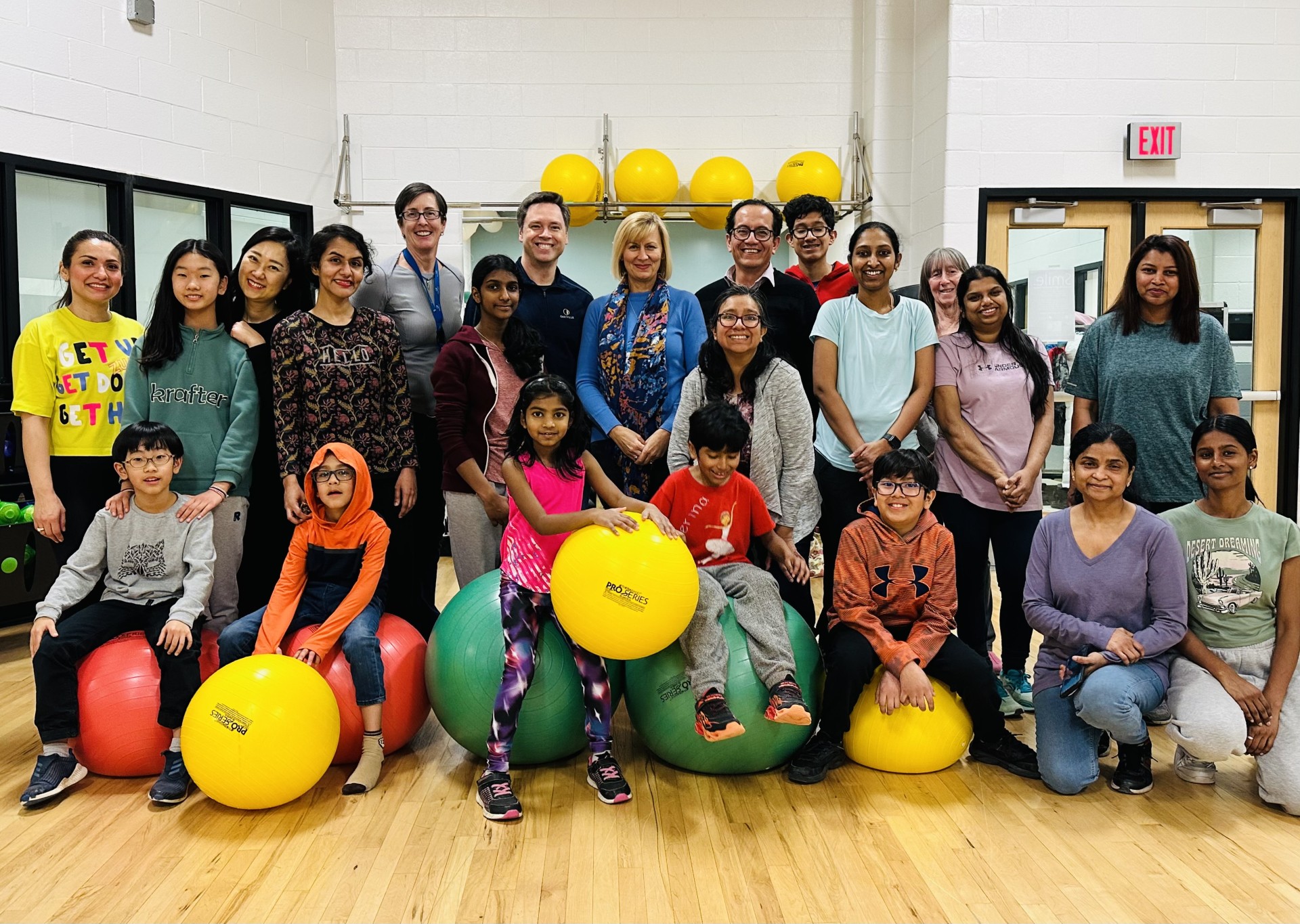 With families at a recreation centre fitness class